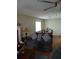 Cozy living room area with hardwood floors, comfortable seating, and a ceiling fan at 2760 Waterford Park Dr, Lawrenceville, GA 30044