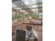 View of covered wooden patio with table and chairs at 2760 Waterford Park Dr, Lawrenceville, GA 30044