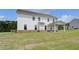 Large backyard with lush lawn, covered patio, and view of the house at 127 Felicity Pike, Locust Grove, GA 30248