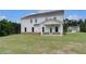 Exterior view showcasing a large backyard with a covered patio at 127 Felicity Pike, Locust Grove, GA 30248