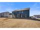 Expansive backyard of a modern home, featuring a covered patio and freshly laid sod at 127 Felicity Pike, Locust Grove, GA 30248