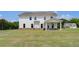 Expansive backyard features a covered patio, ample green space, and is ideal for outdoor activities at 127 Felicity Pike, Locust Grove, GA 30248