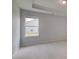 Bright bedroom featuring a window with views of the neighborhood at 127 Felicity Pike, Locust Grove, GA 30248
