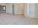 Bedroom with neutral walls and carpets, featuring an open closet space and views to adjacent rooms at 127 Felicity Pike, Locust Grove, GA 30248