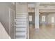 Bright entryway with hardwood floors, stairs, and open view into the living room at 127 Felicity Pike, Locust Grove, GA 30248