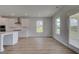 Bright kitchen with white cabinets, a center island, and stainless steel appliances at 127 Felicity Pike, Locust Grove, GA 30248