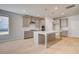 Spacious kitchen featuring large center island, stainless steel appliances, and modern finishes at 127 Felicity Pike, Locust Grove, GA 30248