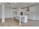 Gorgeous kitchen with white cabinets, center island with quartz countertop and stainless steel appliances at 127 Felicity Pike, Locust Grove, GA 30248