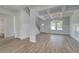 Beautiful living room features an open layout, a coffered ceiling, and vinyl floors at 127 Felicity Pike, Locust Grove, GA 30248