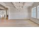 Spacious Living room boasts hardwood floors, decorative ceiling and bright windows at 127 Felicity Pike, Locust Grove, GA 30248