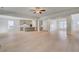 Open-concept design featuring modern kitchen leading into the living area with coffered ceilings at 127 Felicity Pike, Locust Grove, GA 30248