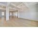 Expansive living room with hardwood floors, decorative ceiling and a chandelier at 127 Felicity Pike, Locust Grove, GA 30248