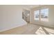 Light-filled living room features hardwood floors and staircase at 127 Felicity Pike, Locust Grove, GA 30248
