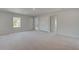 Spacious main bedroom with carpeted floors and abundant closet space at 127 Felicity Pike, Locust Grove, GA 30248