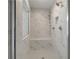 Walk-in shower with marble tile, shower head, and built-in bench at 127 Felicity Pike, Locust Grove, GA 30248