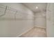 Spacious walk-in closet with carpeted flooring and ample shelving for organized storage at 127 Felicity Pike, Locust Grove, GA 30248