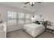 Bright bedroom featuring large windows, vaulted ceilings, and neutral decor at 1741 Stanwood Dr, Kennesaw, GA 30152