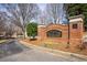 Welcoming brick Cedar Lake neighborhood sign surrounded by landscaped greenery and trees at 1741 Stanwood Dr, Kennesaw, GA 30152