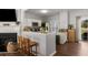 Open kitchen features granite countertops, white cabinets, and a breakfast bar for casual dining at 1741 Stanwood Dr, Kennesaw, GA 30152