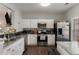 Bright kitchen with granite countertops, stainless appliances, and ample counter space at 1741 Stanwood Dr, Kennesaw, GA 30152