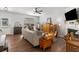 Bright living room boasts hardwood floors, fireplace, large windows, and seamless flow to kitchen at 1741 Stanwood Dr, Kennesaw, GA 30152
