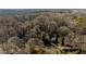 Wide angle aerial shot of property and lush treed neighborhood at 2183 Rhinehill Se Rd, Atlanta, GA 30315