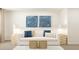 Open living room with white sofa, calming art, and natural lighting throughout at 2445 Livi Ln, Buford, GA 30519