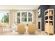 Bright living room with ample seating, fireplace, natural lighting, and a view of outdoors at 2445 Livi Ln, Buford, GA 30519