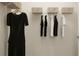 Organized walk-in closet with hanging rods and shelves, offering plenty of storage for clothes and accessories at 2445 Livi Ln, Buford, GA 30519