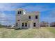 Newly built two-story home showcasing a pristine backyard and exterior in a suburban setting at 237 Chiswick Loop, Stockbridge, GA 30281