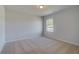 Neutral bedroom features plush carpet, one window, and lots of natural light at 237 Chiswick Loop, Stockbridge, GA 30281