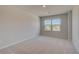 Neutral bedroom features plush carpet, two windows, and lots of natural light at 237 Chiswick Loop, Stockbridge, GA 30281