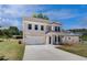 Charming two-story home with a two-car garage and a long driveway at 237 Chiswick Loop, Stockbridge, GA 30281