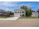 Charming two-story home with a two-car garage and a well-manicured front yard at 237 Chiswick Loop, Stockbridge, GA 30281