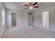 Bright main bedroom with carpeted floor, ceiling fan and multiple entry ways at 237 Chiswick Loop, Stockbridge, GA 30281