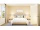 Cozy bedroom with neutral tones, comfortable bed, and side tables, creating a relaxing and inviting atmosphere at 2447 Livi Ln, Buford, GA 30519