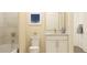 Bright bathroom with granite countertops, a shower with curtain, toilet, and white vanity at 2451 Livi Ln, Buford, GA 30519