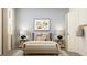 Inviting bedroom with a comfortable bed, stylish lamps, and a cozy rug for a relaxing ambiance at 2451 Livi Ln, Buford, GA 30519