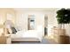 Serene bedroom with a plush bed, soft lighting, and a minimalist design for a relaxing atmosphere at 2451 Livi Ln, Buford, GA 30519