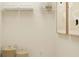 Bright closet with storage shelves, decorative baskets, and artwork on the wall at 2451 Livi Ln, Buford, GA 30519