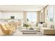 Bright and airy living room featuring a comfortable sectional sofa, open to the kitchen area at 2451 Livi Ln, Buford, GA 30519