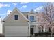 Lovely home featuring a garage and blooming tree at 3805 Delfaire Trce, Cumming, GA 30040