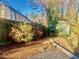 View of backyard with lush foliage, wooden fence and shed at 5206 Westhill Nw Dr, Norcross, GA 30071