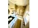Full bathroom with vanity, and tub with tile surround plus a bright window at 5206 Westhill Nw Dr, Norcross, GA 30071