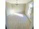 Bright dining room features hard surface flooring and stylish chandelier at 5206 Westhill Nw Dr, Norcross, GA 30071