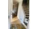 Hallway view features wood floors and staircase with dark stained treads at 5206 Westhill Nw Dr, Norcross, GA 30071