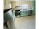 Kitchen featuring stainless steel appliances, stone countertops and stylish cabinetry at 5206 Westhill Nw Dr, Norcross, GA 30071