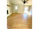 Bright living room with hardwood floors, fireplace, and ceiling fan at 5206 Westhill Nw Dr, Norcross, GA 30071