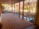 Inviting covered porch offers a relaxing outdoor space with views of mature trees at 5206 Westhill Nw Dr, Norcross, GA 30071