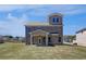 Large backyard with brick home and a covered patio at 132 Dalston Cv, Stockbridge, GA 30281